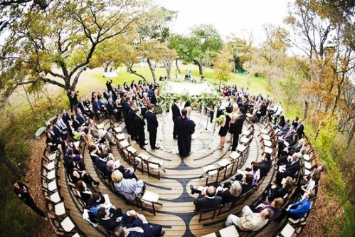 An outdoor wedding in the round on a fabulous round deck